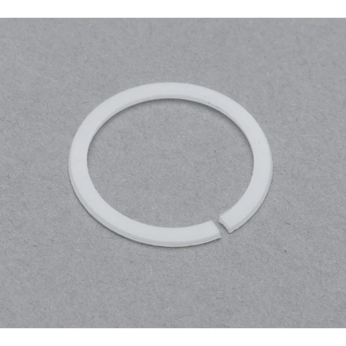 T&S Brass 009538-45 white Delrin split swivel washer with 1-inch outer diameter on gray background