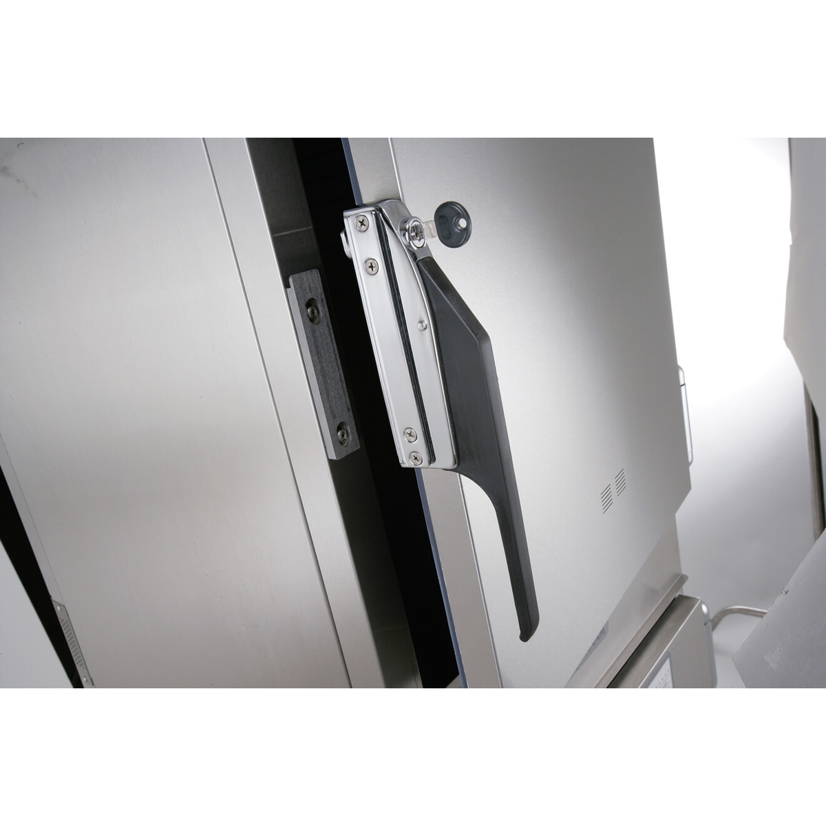 Close-up of Alto-Shaam cook and hold oven antimicrobial door handle with magnetic latch and key lock