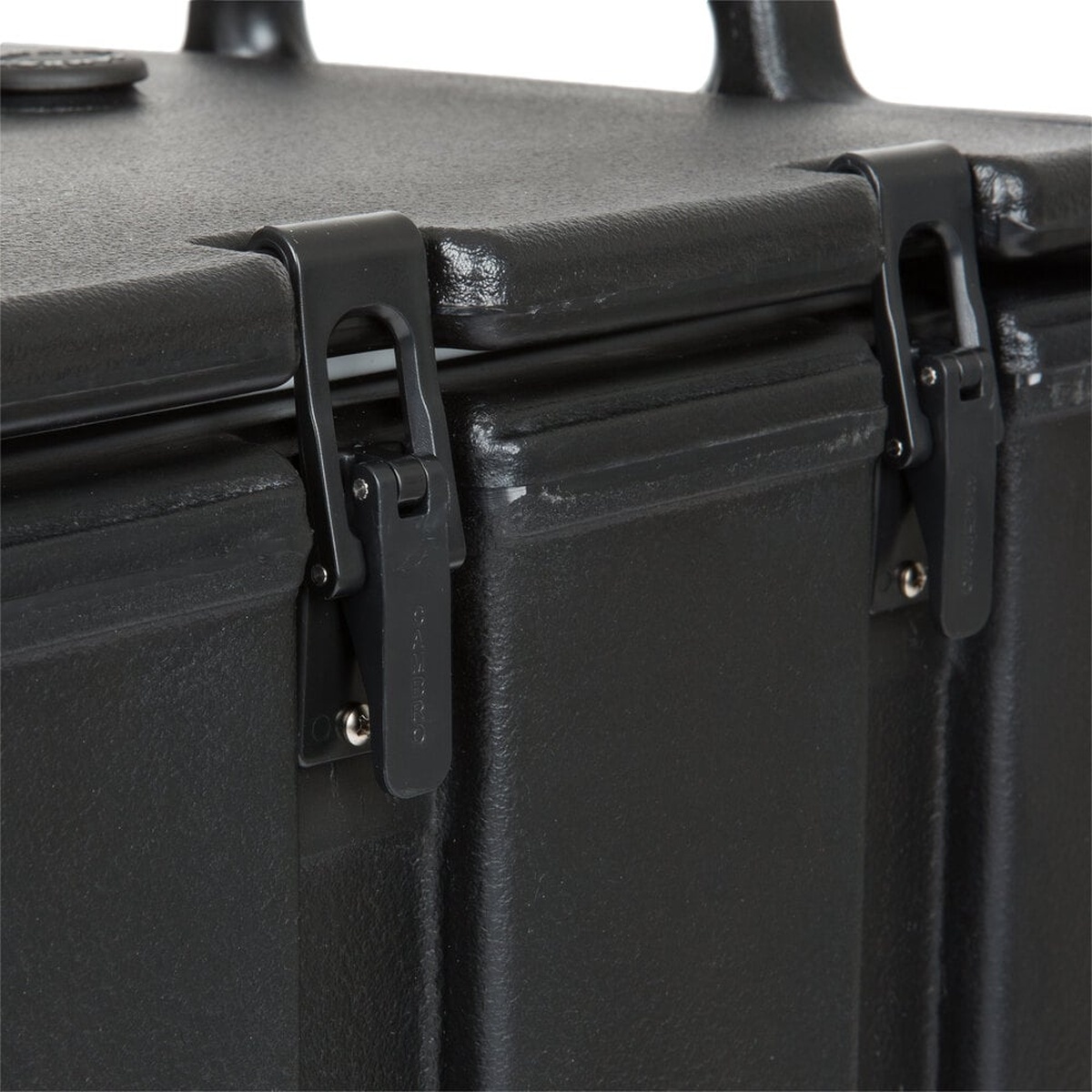 Close-up of recessed plastic latches with molded-in metal backing plates on the Cambro 1000LCD110 beverage dispenser