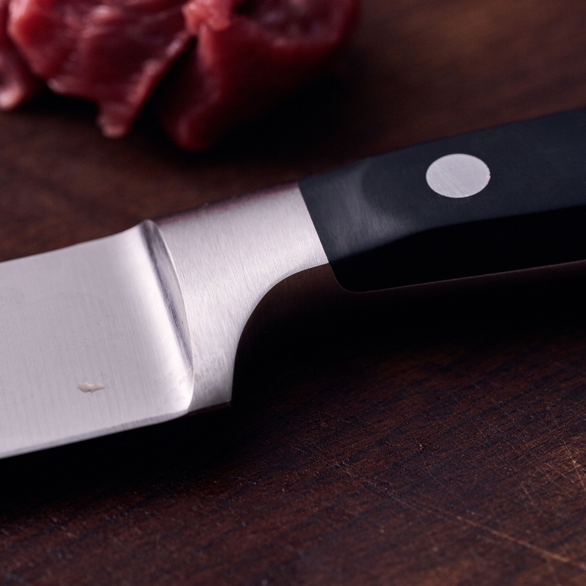 Close up of the ergonomic triple rivet handle and bolster of the Zwilling knife