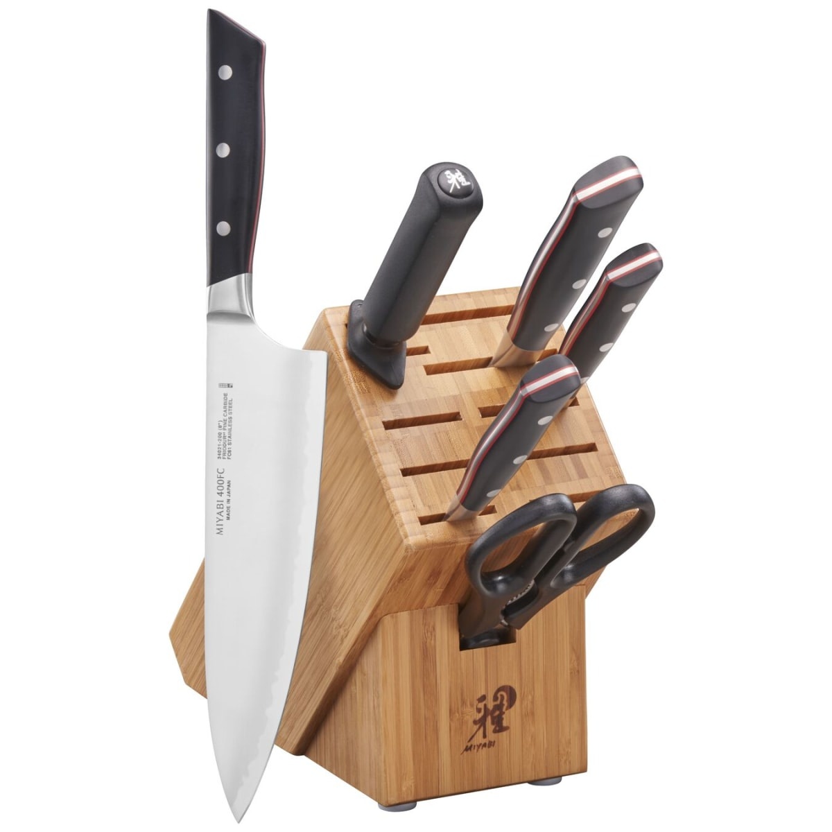 Miyabi Evolution 7-piece knife set displayed with knives stored in a natural bamboo wood block, featuring an 8-inch chef's knife prominently in the foreground