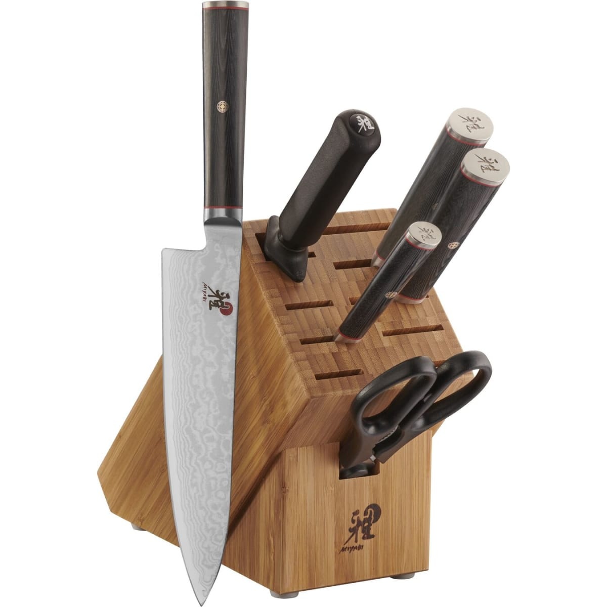 Miyabi Kaizen 7-Piece Knife Block Set displayed with chef knife leaning against a bamboo storage block alongside honing steel, kitchen shears, and additional knives