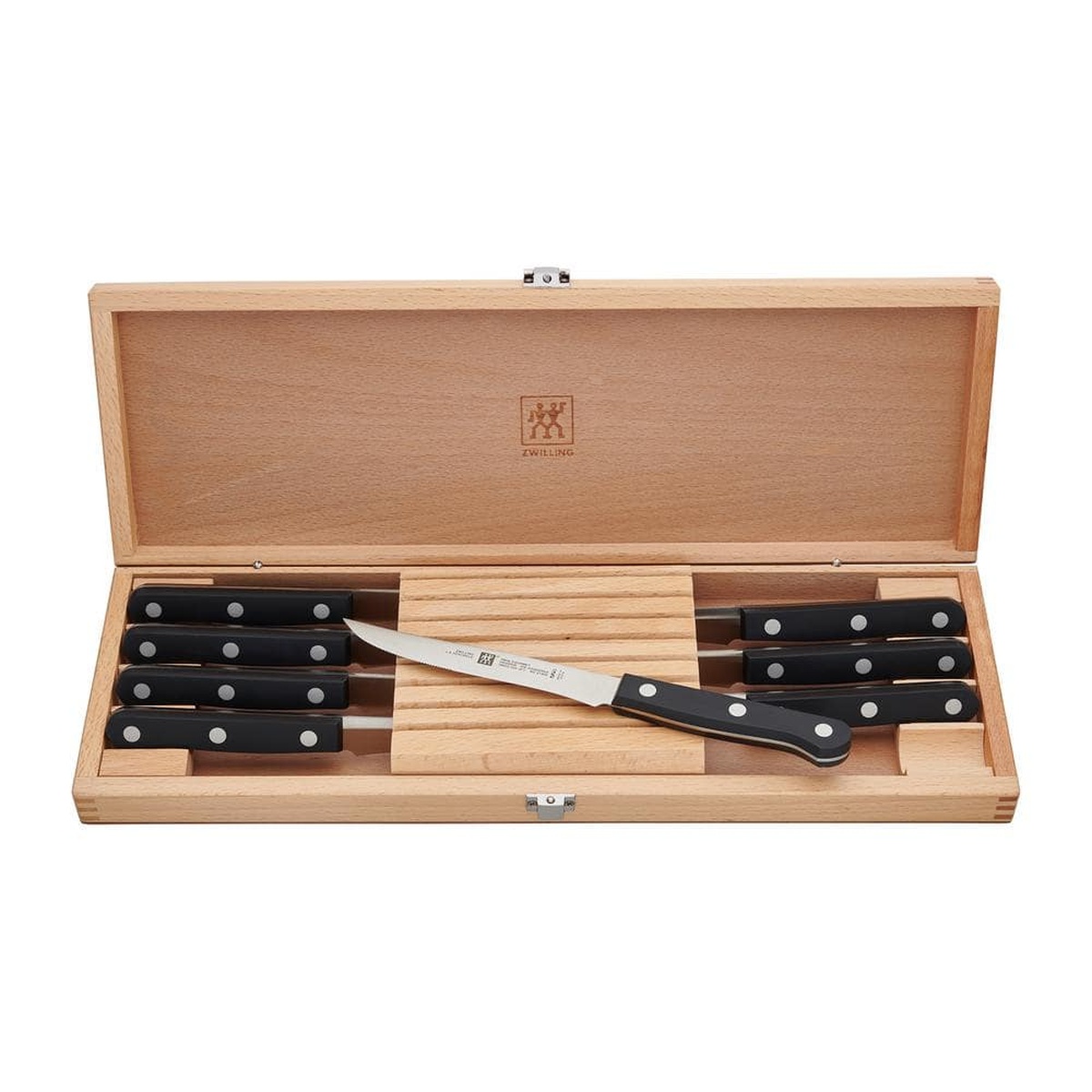ZWILLING Twin Gourmet 8-piece steak knife set displayed open in wood presentation box with one knife shown