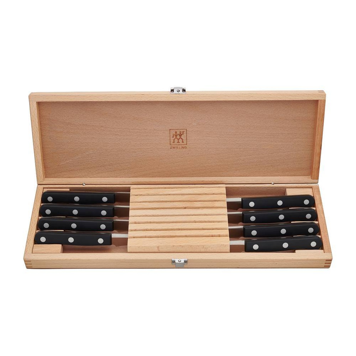 Eight ZWILLING Twin Gourmet steak knives with black triple-riveted handles arranged in open wood box