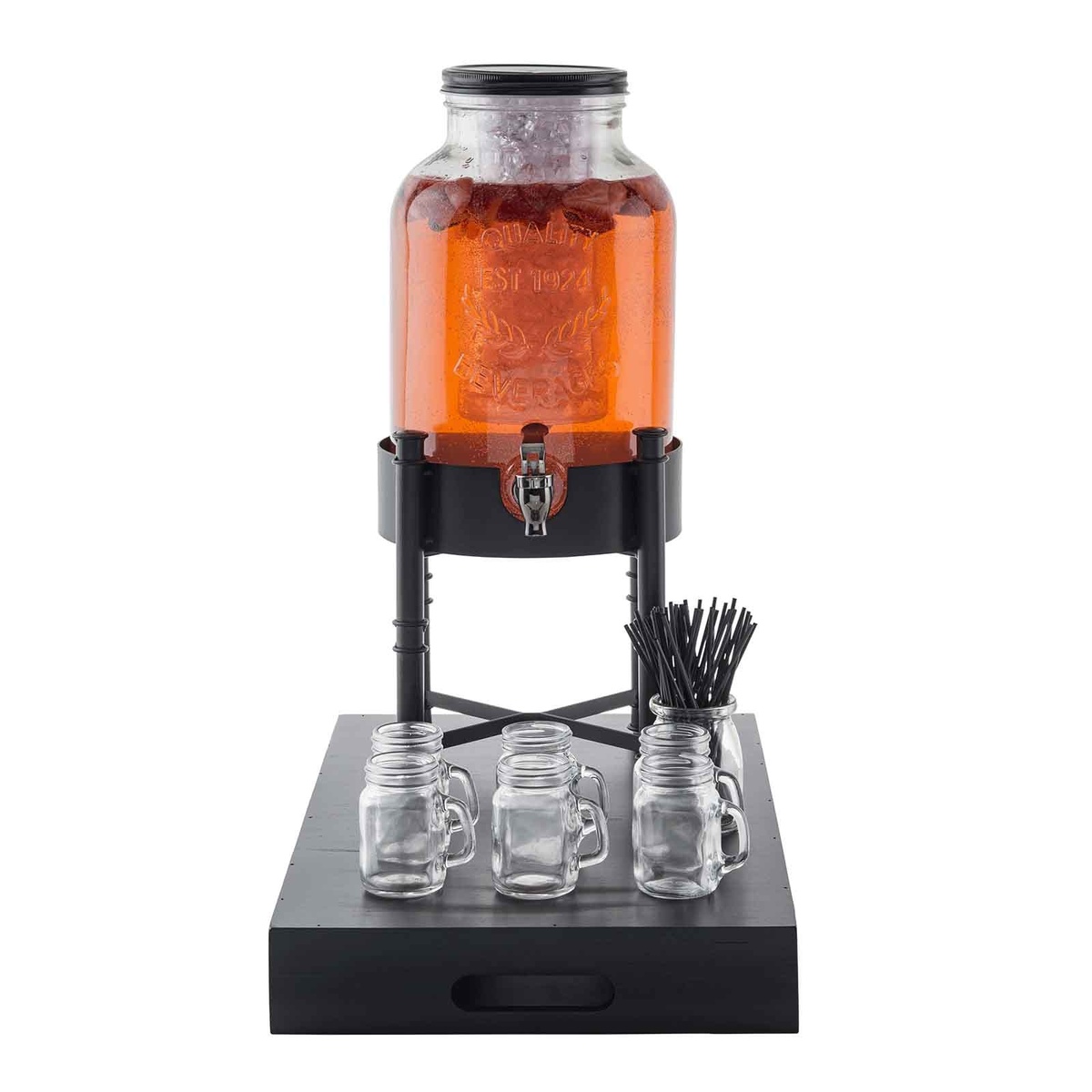 TableCraft 10262 dispenser stand supporting a glass beverage jar filled with orange drink, displayed with mason jar glasses on a black serving tray