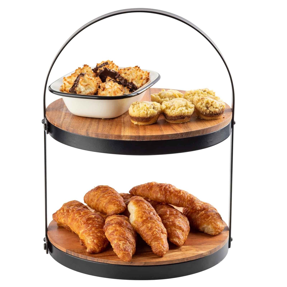 Two-tiered acacia wood display stand loaded with croissants on the lower tier and cookies and mini tarts on the upper tier