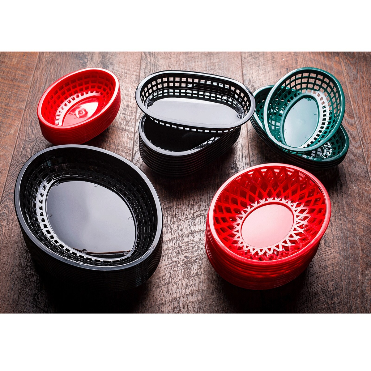 Assorted TableCraft classic plastic serving baskets in black and red stacked together, showing stackable storage feature