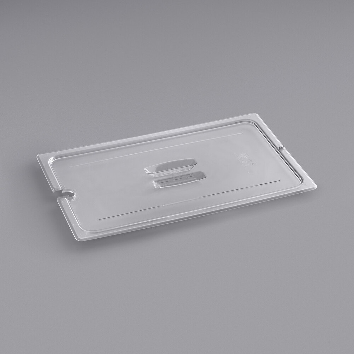 Cambro 10CWCHN135 full size clear polycarbonate handled lid with spoon notch, shown on neutral gray background