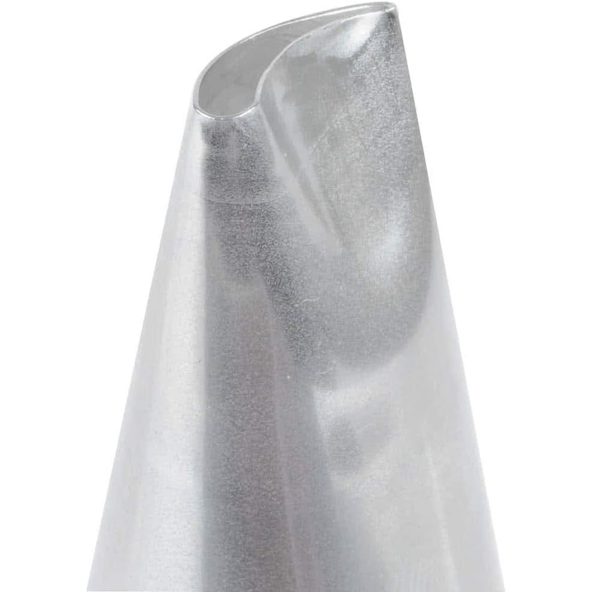 Close-up of Ateco 121 curved petal piping tip opening showing the distinctive curved U-shaped slot