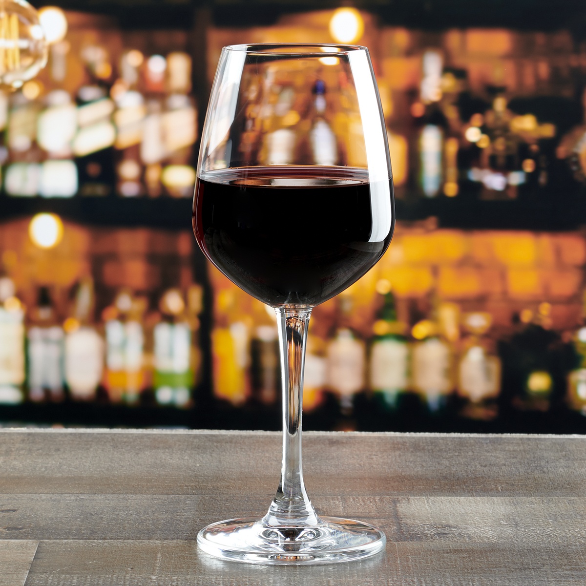 Anchor Hocking Florentine II all-purpose wine glass filled with red wine, shown on a wooden surface