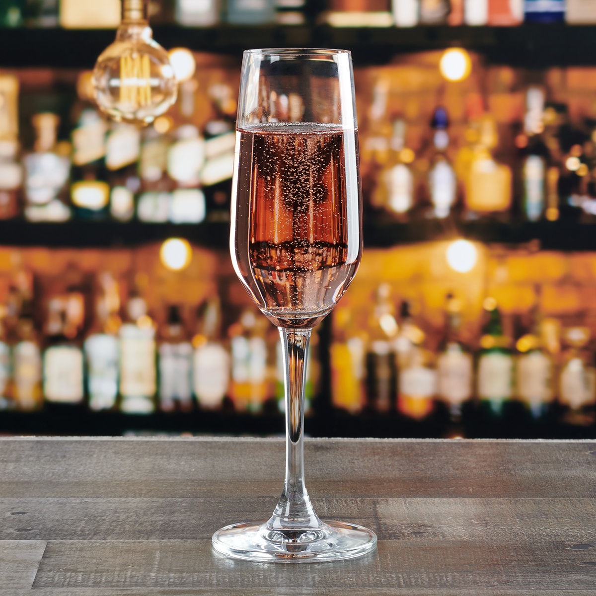 Anchor Hocking Florentine II 6.25 oz. champagne flute filled with sparkling rosé