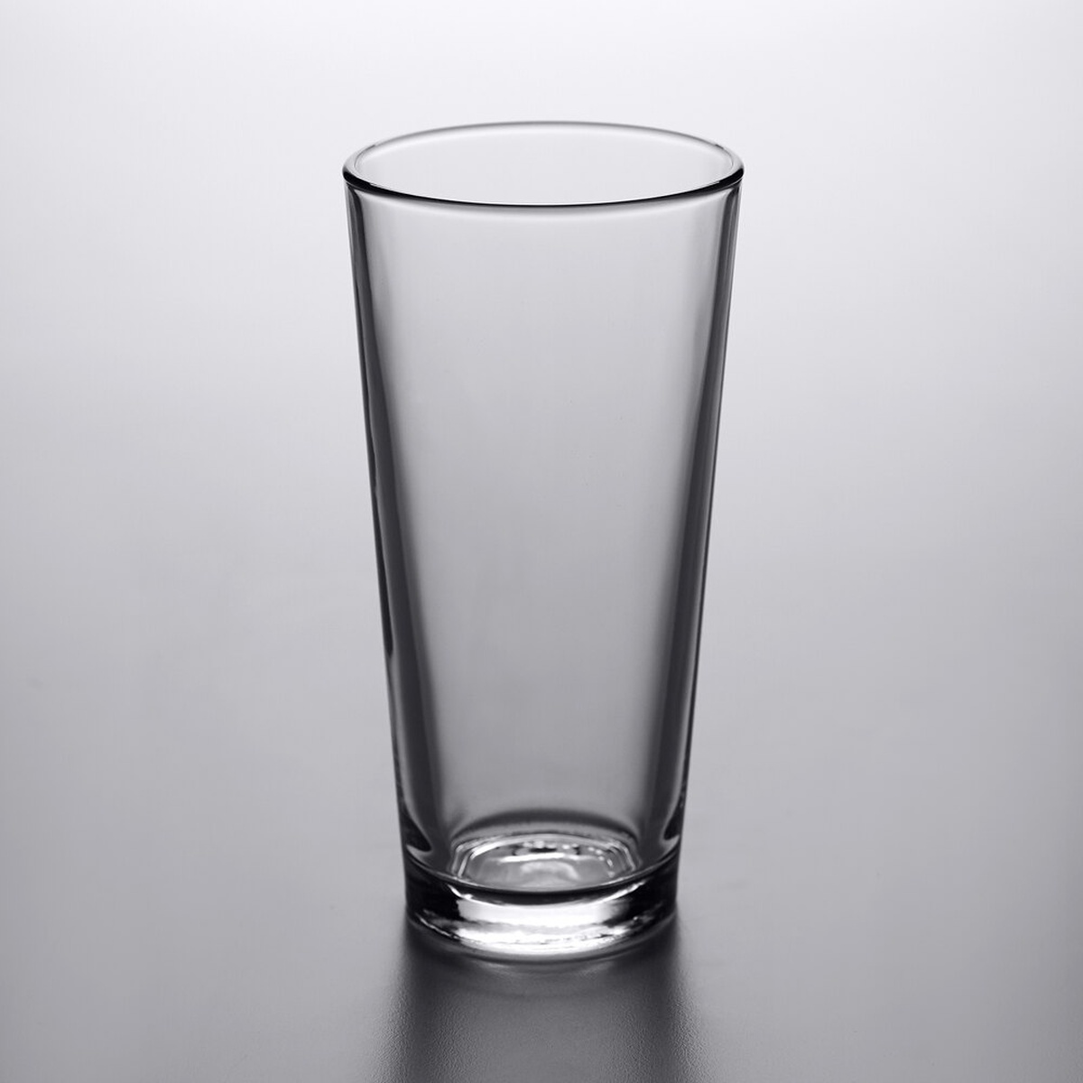 Libbey 15144 Restaurant Basics 20 oz. tall mixing glass, clear, shown on gray background