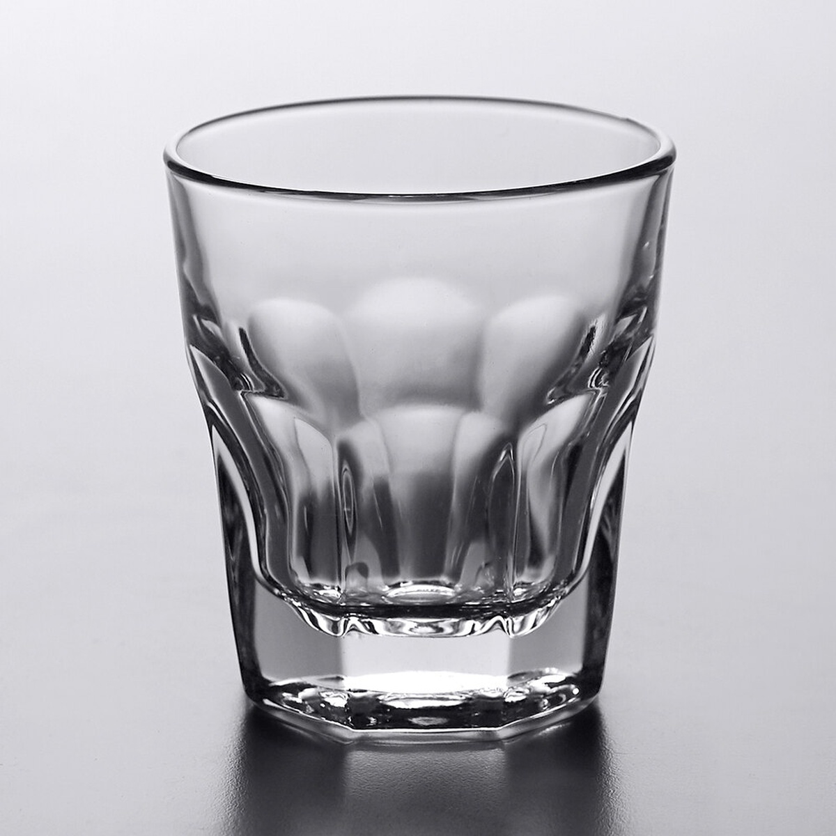 Libbey Gibraltar 15240 8 oz. rocks glass showing paneled sides and octagonal base on gray background