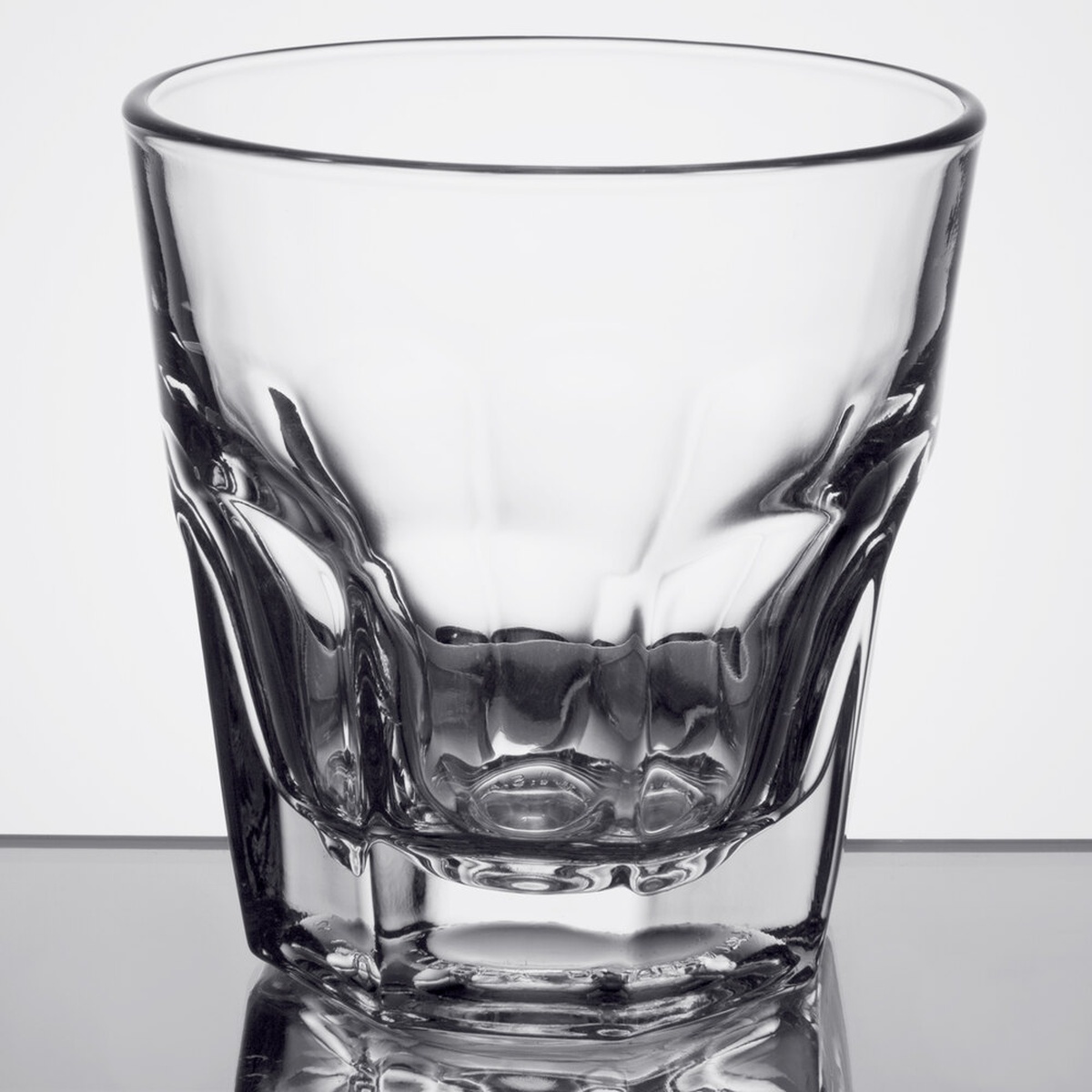 Close-up of Libbey Gibraltar 15240 rocks glass highlighting the thick sham base and paneled lower body