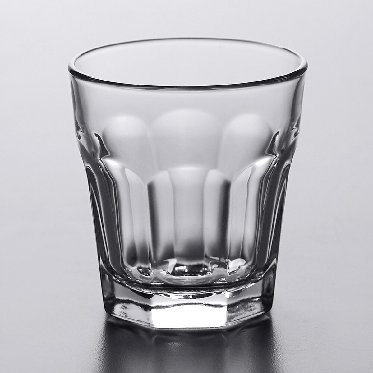 Libbey Gibraltar 15242 9 oz clear rocks glass with paneled octagonal body on gray background