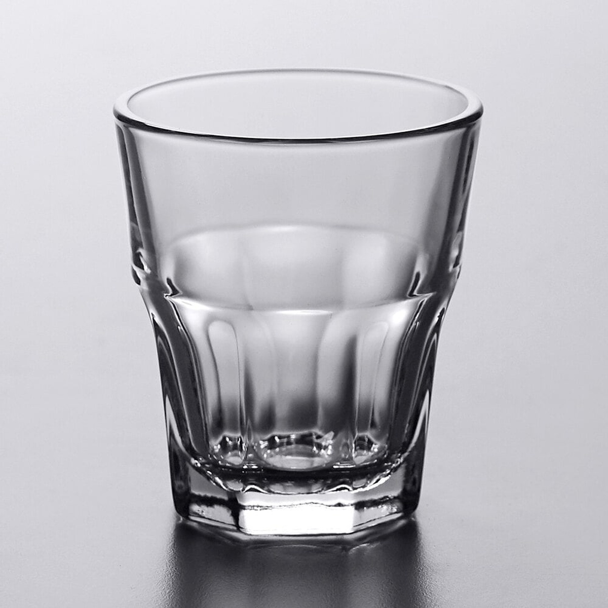 Libbey Gibraltar 5.5 oz rocks glass showing octagonal base and paneled sides on gray background