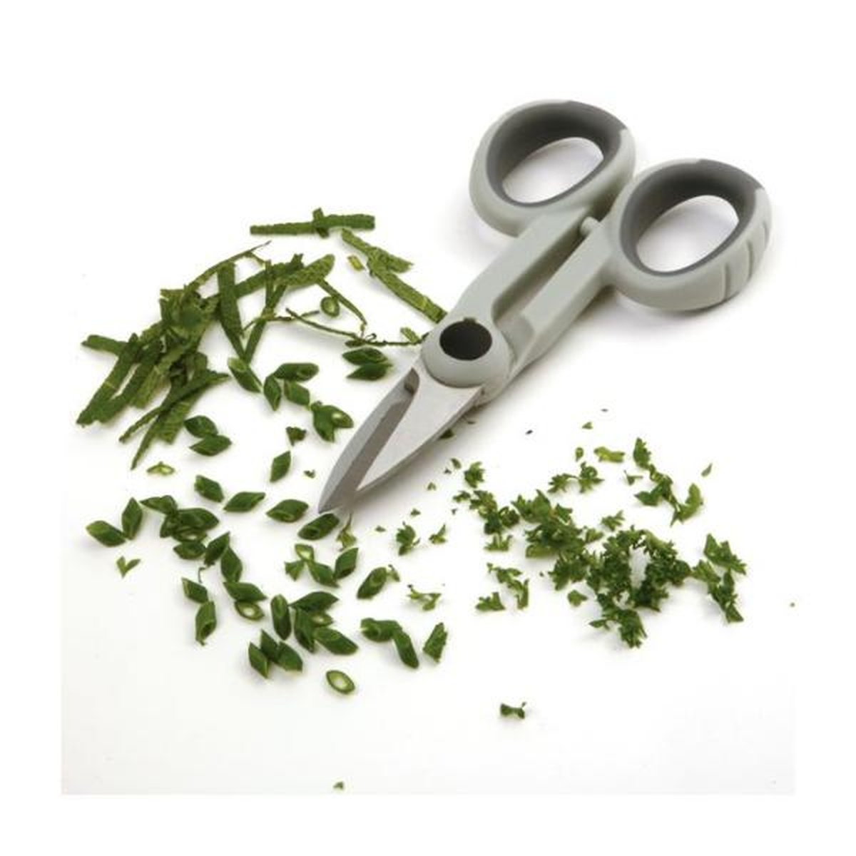 Norpro My Favorite Scissors shown with freshly cut herbs including minced parsley and sliced chives on a white background