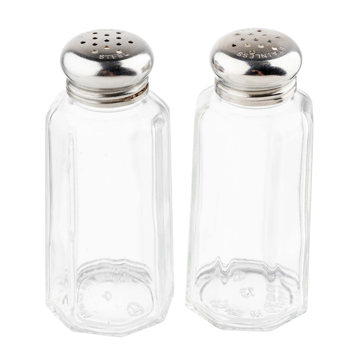 Pair of TableCraft paneled glass salt and pepper shakers with stainless steel tops side by side