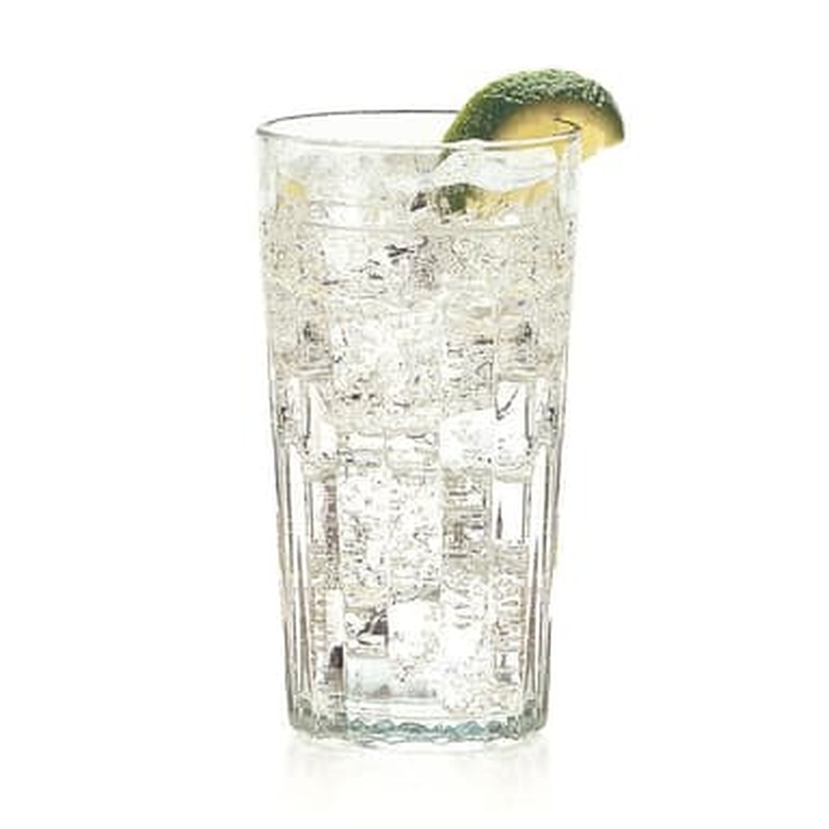 Libbey paneled cooler glass filled with sparkling water, ice, and a lime wedge garnish