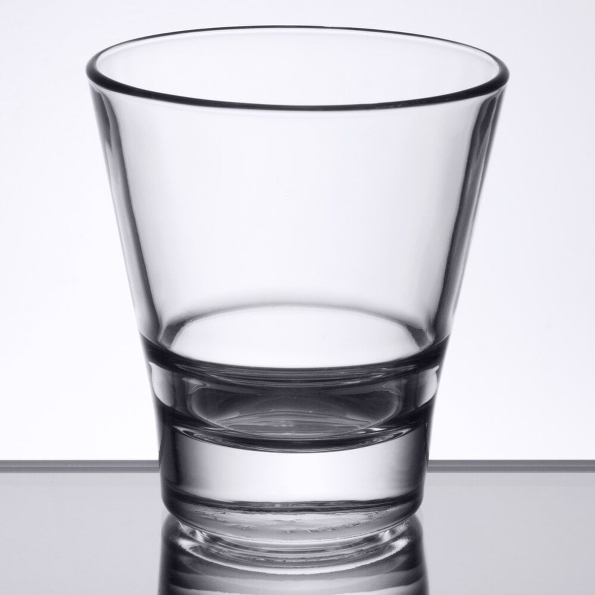 Libbey Endeavor 9 oz rocks glass showing angular tapered shape and heavy sham base from a slightly elevated angle
