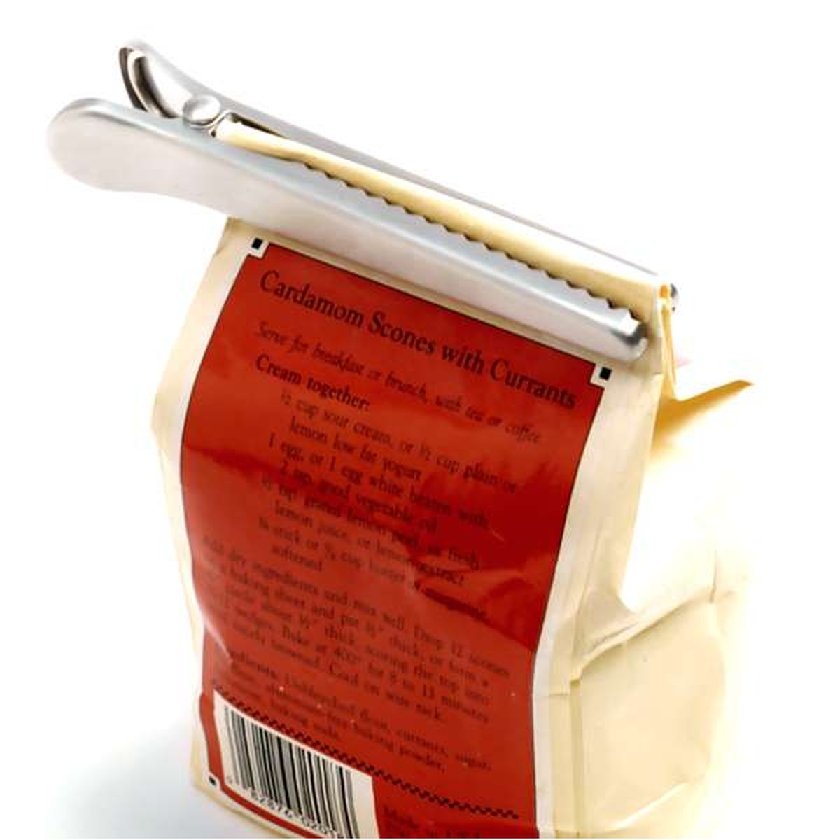 Single Norpro stainless steel jaw clip clamped onto the top of a paper bag