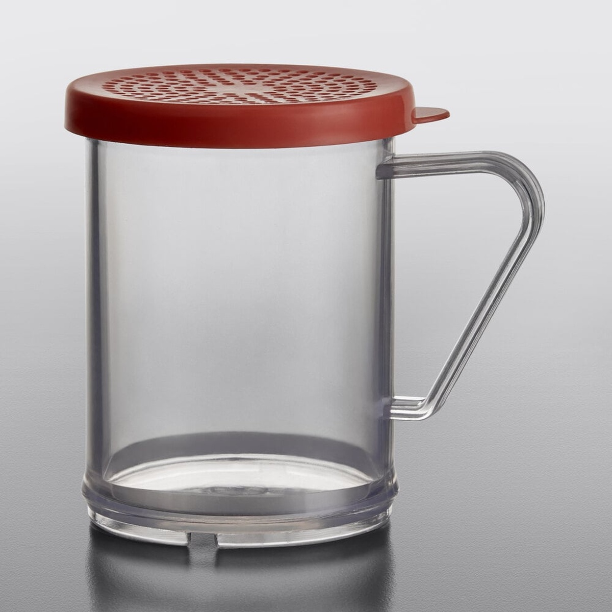 Tablecraft 166C clear polycarbonate dredge shaker with red perforated lid and integrated handle