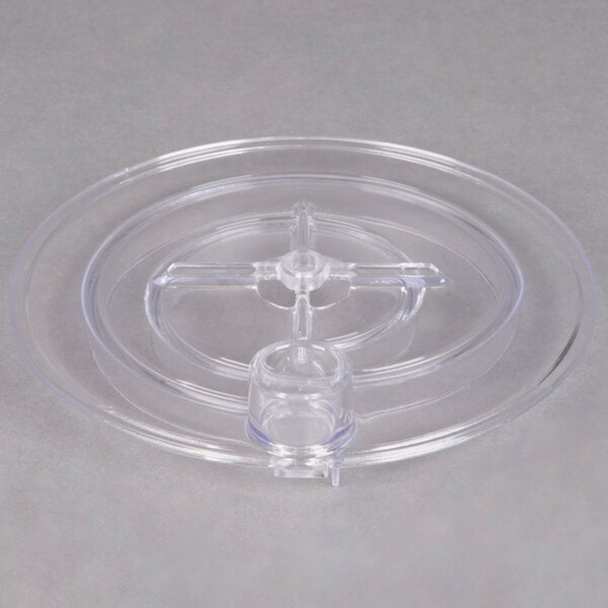 Crathco 1735 clear plastic pump cover, angled side view showing raised center hub and drain fitting