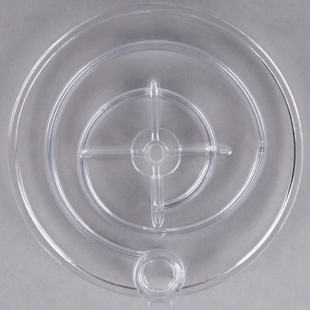 Crathco 1735 clear plastic pump cover, top-down view showing cross-shaped impeller mount and center drain port