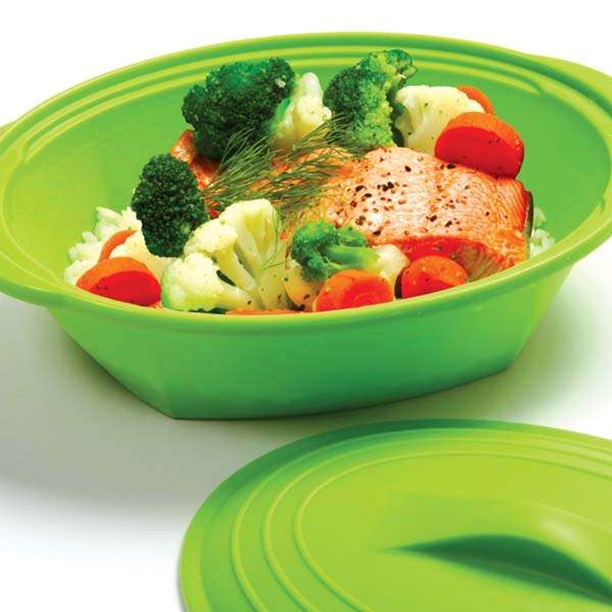 Norpro silicone steamer base filled with steamed salmon, broccoli, cauliflower, and carrots