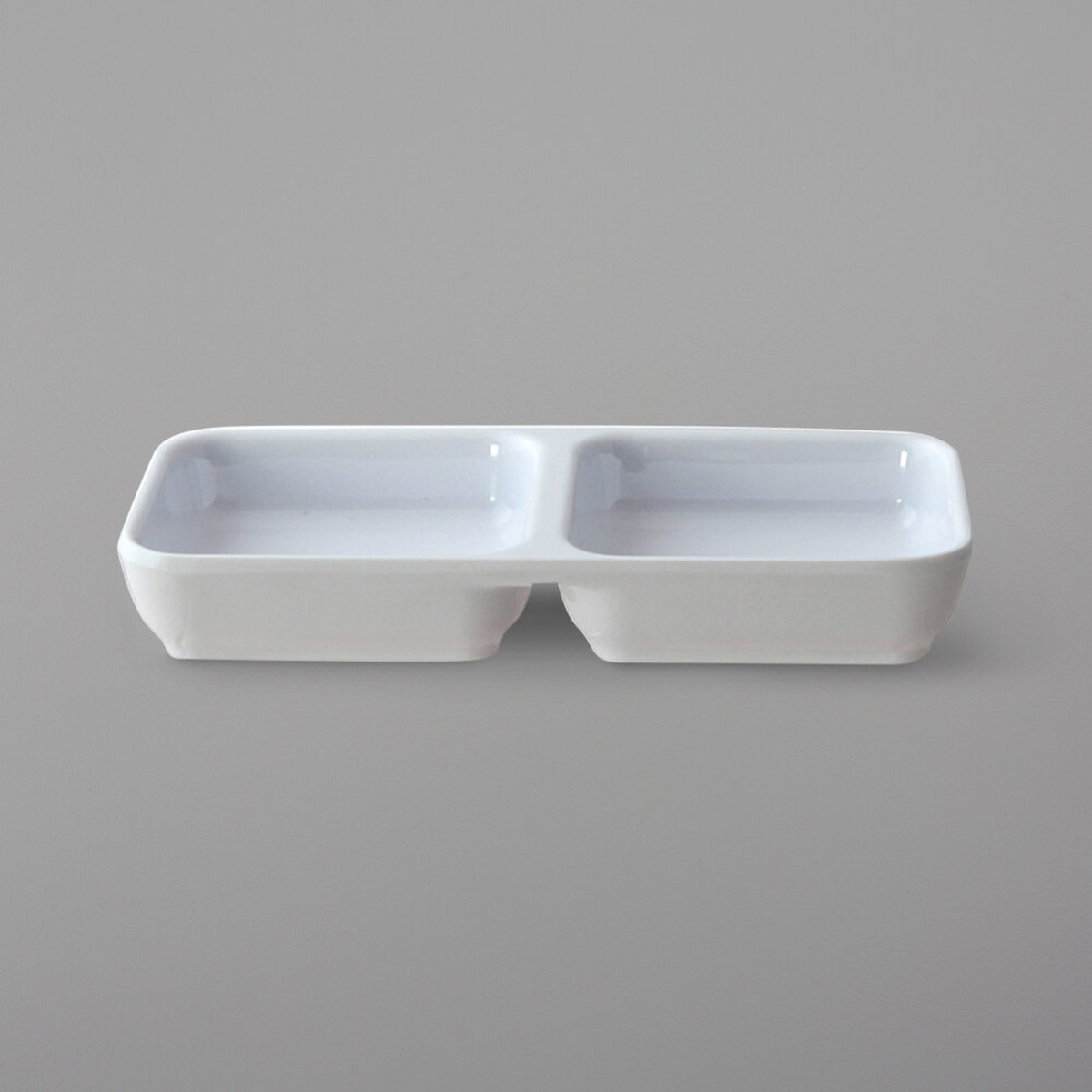 Thunder Group 19002WT classic white rectangular melamine two-compartment sauce dish, top angle view showing dual wells