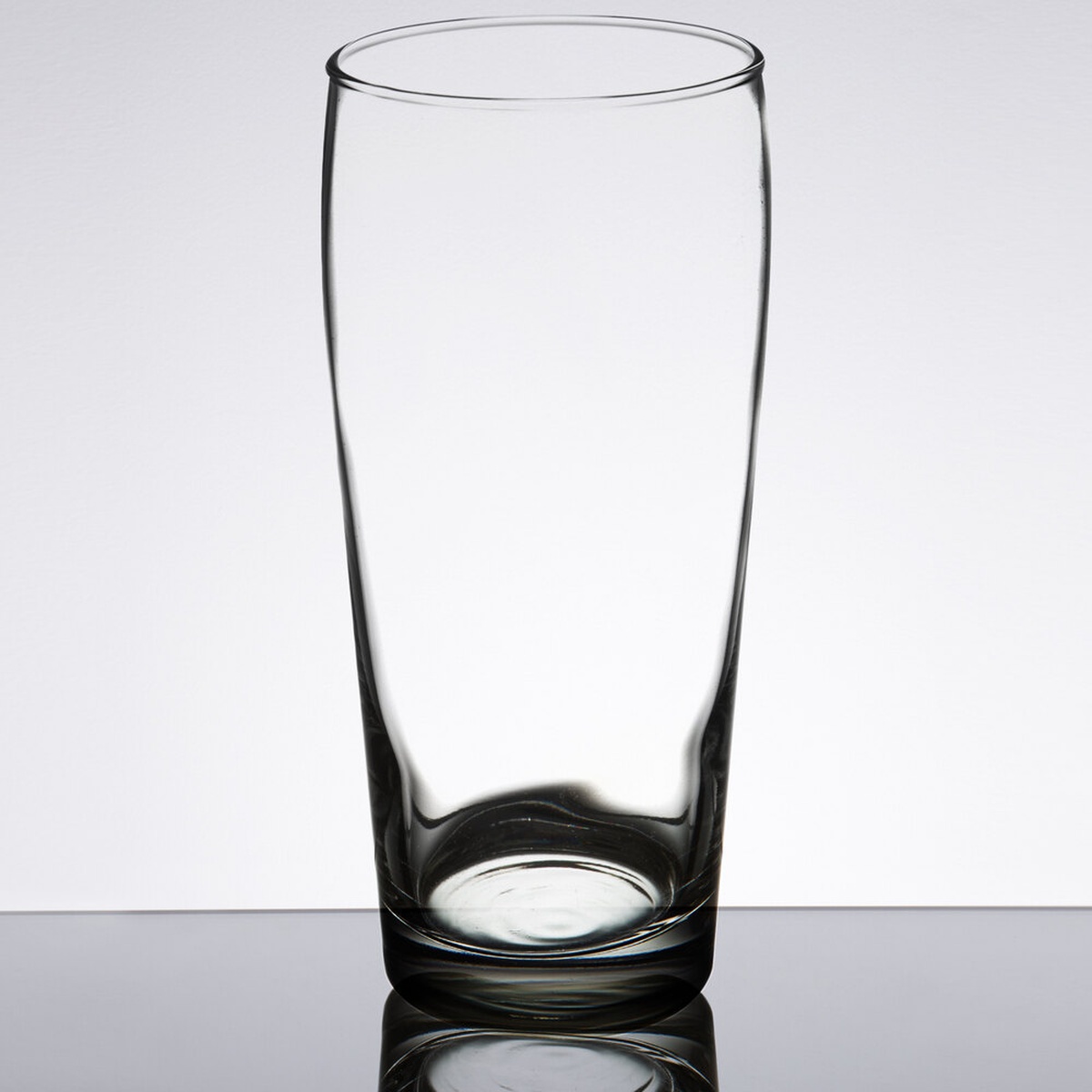 Libbey 196 20 oz. clear pub glass with thick sham base and tapered top, shown from the front