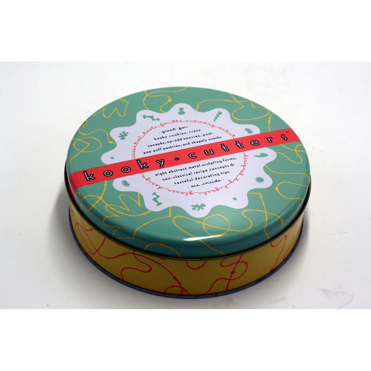 Kooky Cutters decorative round tin with green lid and red banner label