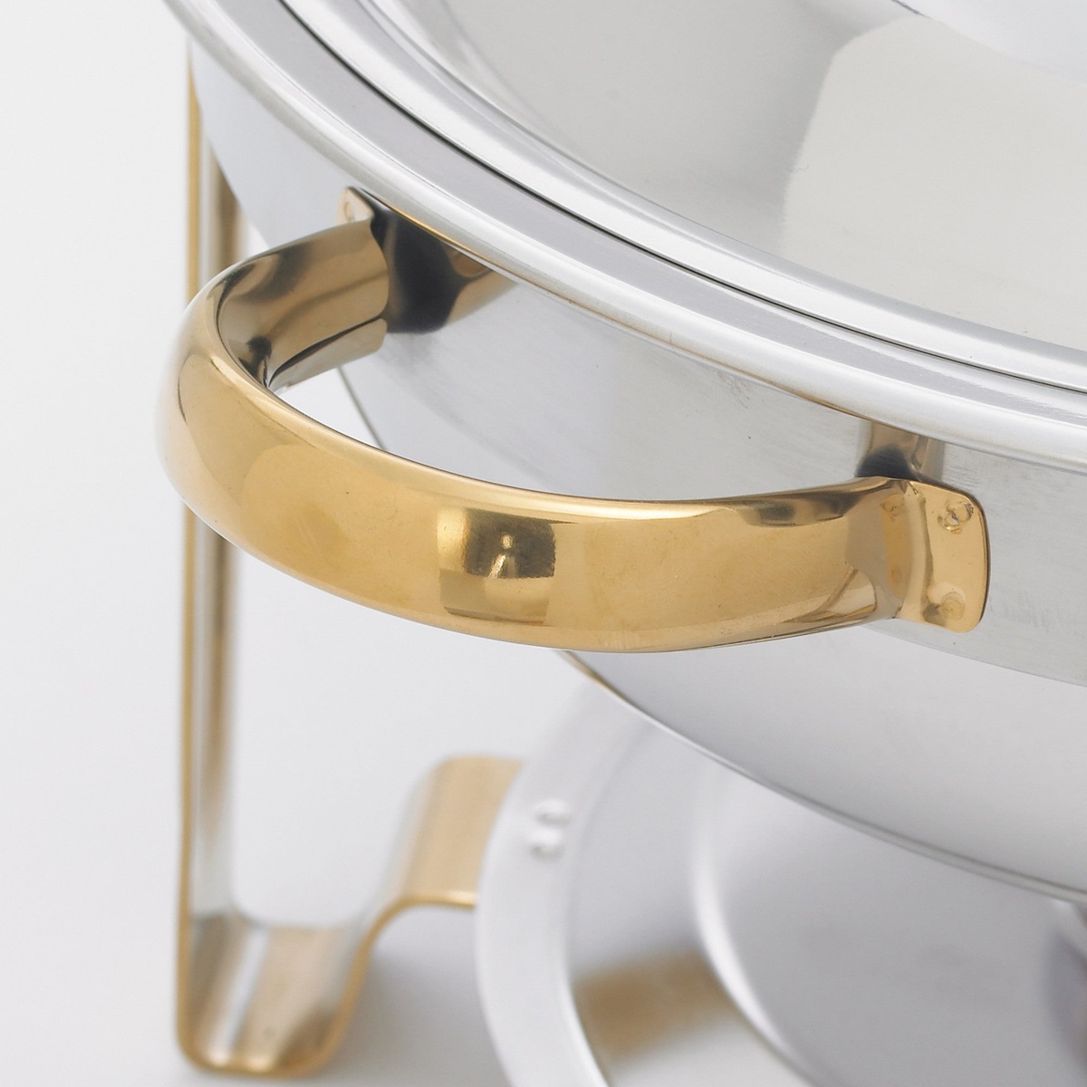 Close-up of the gold-tone easy-grip handle on the Winco 203 Malibu round chafing dish
