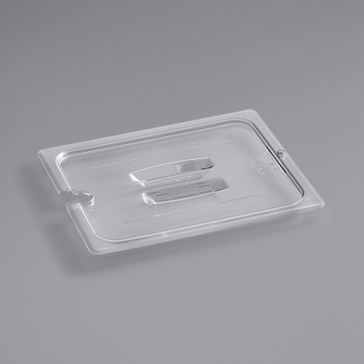 Cambro 20CWCHN135 clear polycarbonate half-size food pan lid with molded handle and spoon notch, shown on gray background