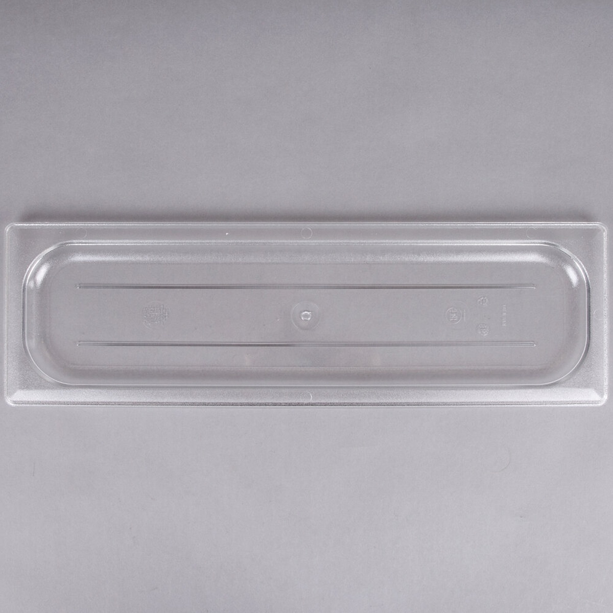 Cambro 20LPCWC135 clear polycarbonate 1/2 size long flat food pan lid, overhead view on neutral background