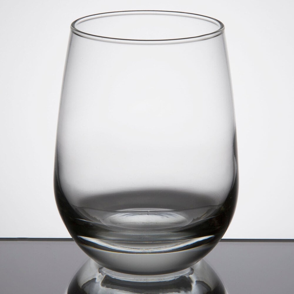 Libbey 231 clear stemless white wine glass, 15.25 oz, shown on a reflective surface