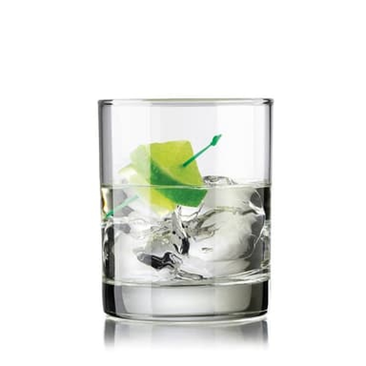 Libbey Lexington Double Old Fashioned glass filled with a clear cocktail, ice, and a lime wedge garnish on a white background