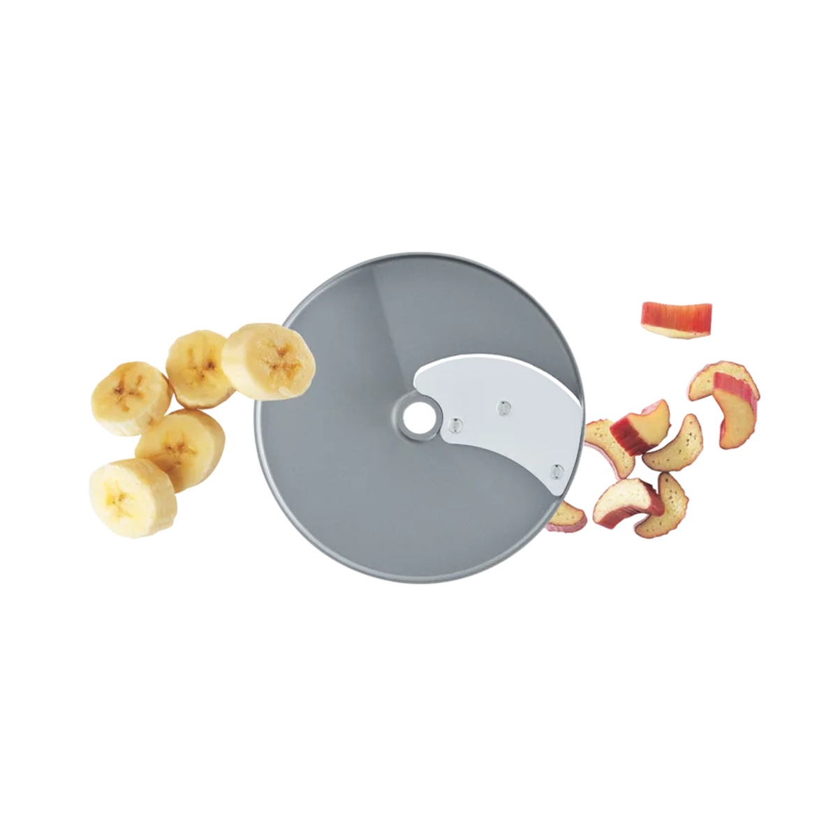 Robot Coupe slicing disc surrounded by freshly sliced bananas and apple pieces