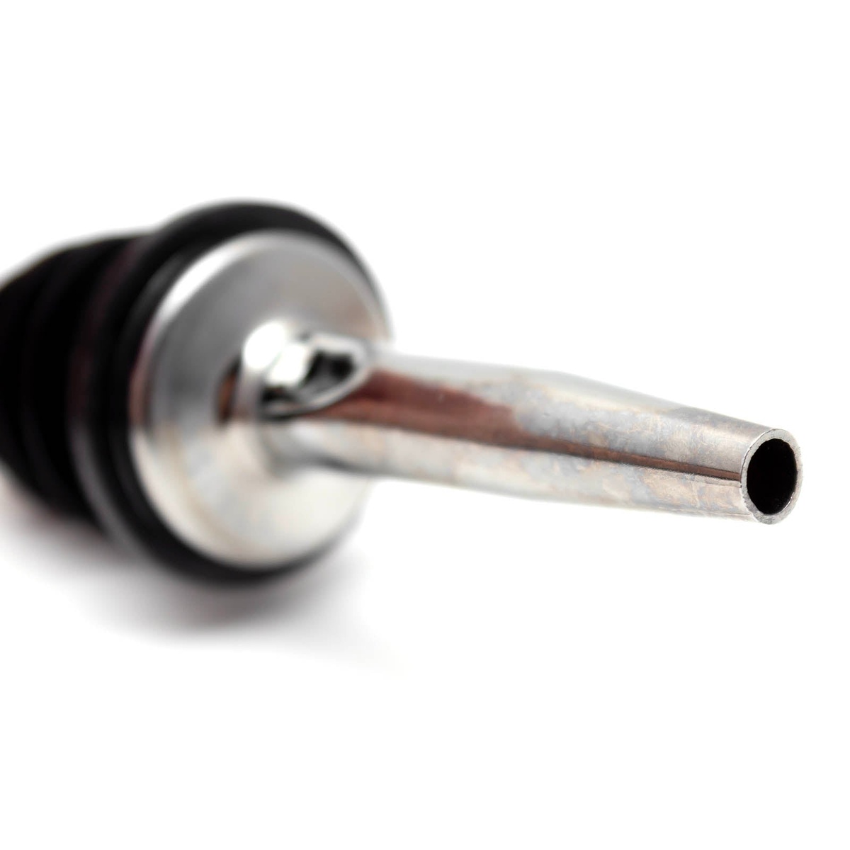 Close-up macro view of the tapered chrome spout tip of the Spill-Stop 285-50 pourer on white background