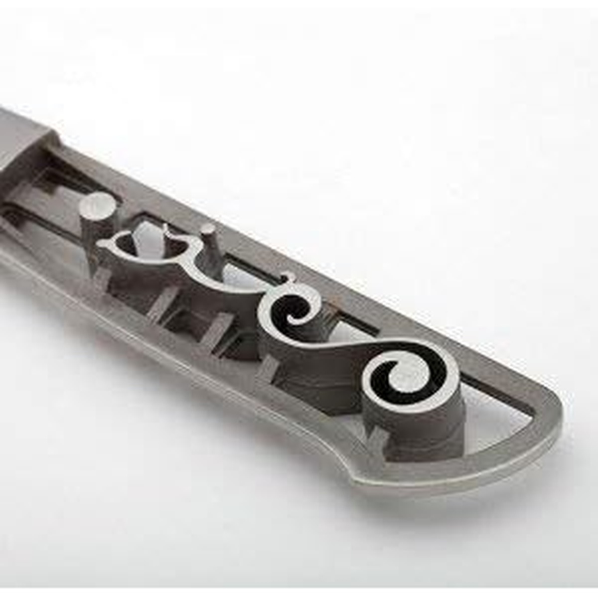 Close-up of the I.O. Shen Maoui Deba Knife's ebonite Tai Tang handle showing internal frame structure and decorative Yin Yang motif