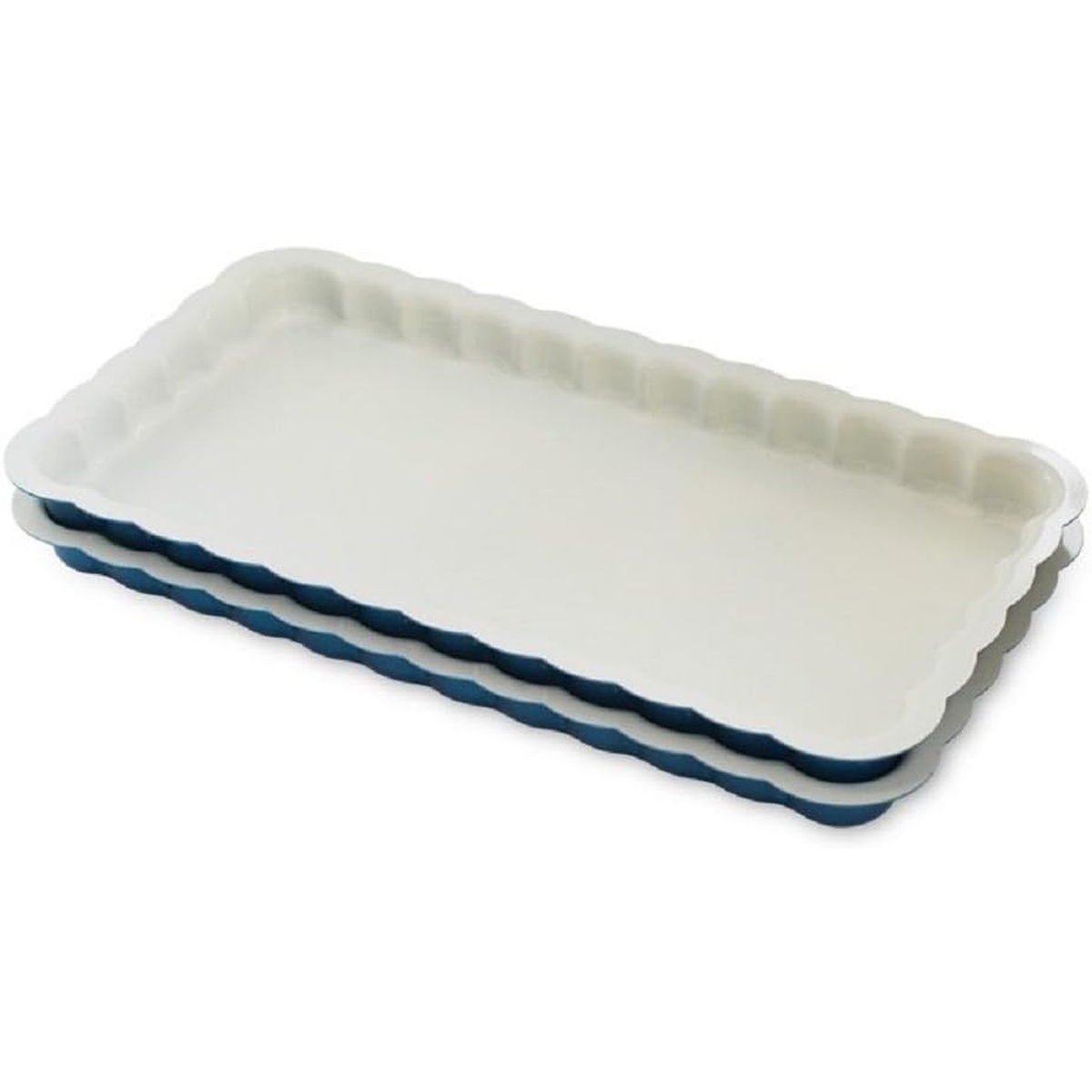 Nordic Ware Celebrations Stackable Loaf Pans, set of two, showing navy exterior and white nonstick interior with scalloped edges