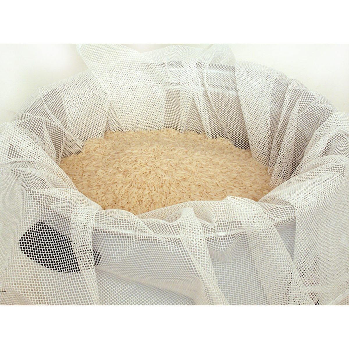 Town 32925 nylon mesh rice napkin lining the inside of a rice pot filled with uncooked white rice
