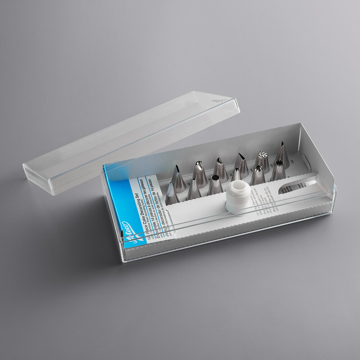 Ateco 333 14-piece cake decorating set open in clear plastic storage box showing 12 stainless steel piping tips, white coupler, and instruction card
