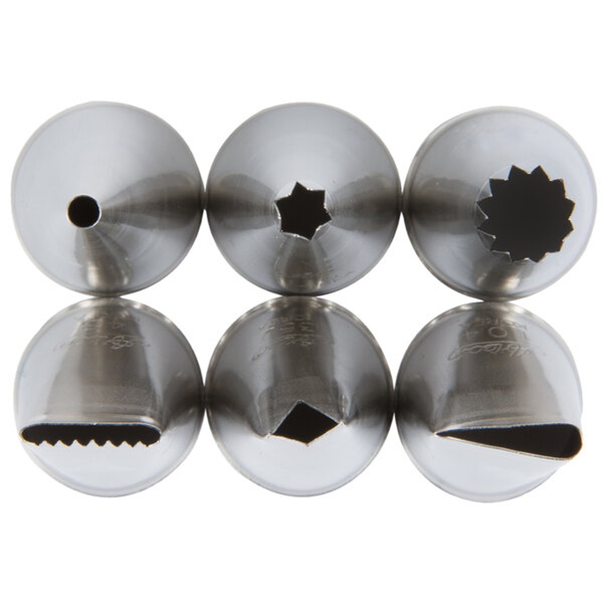 Close-up view of six Ateco stainless steel piping tip openings including round, closed star, open star, basket weave, open star, and leaf tips