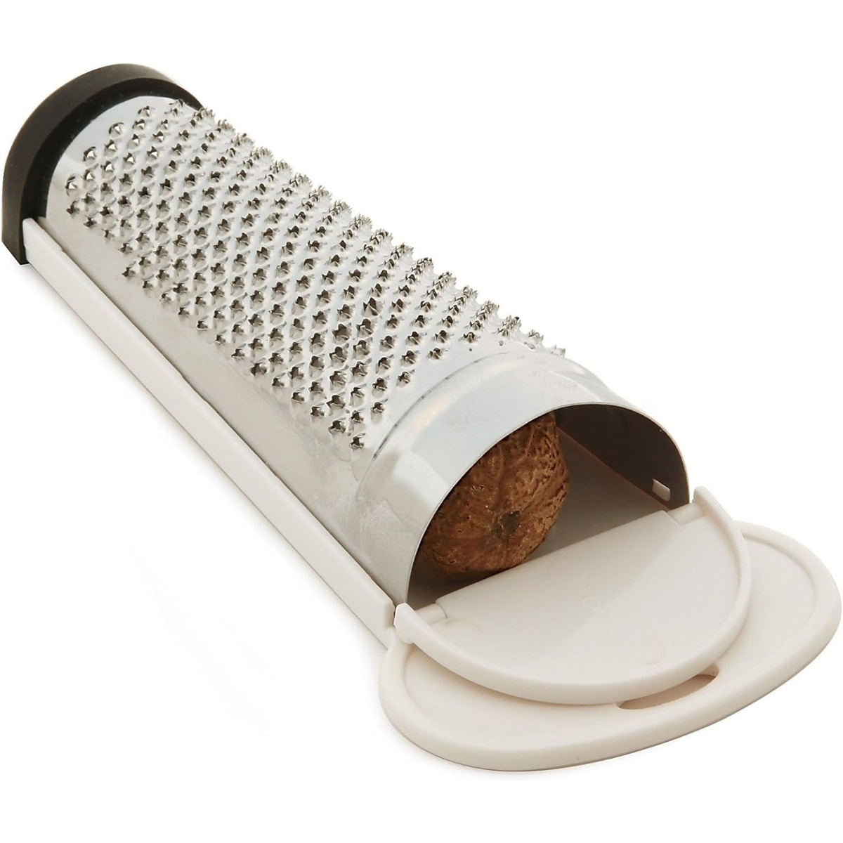 Norpro nutmeg grater with storage compartment open, showing a whole nutmeg stored inside the white plastic housing