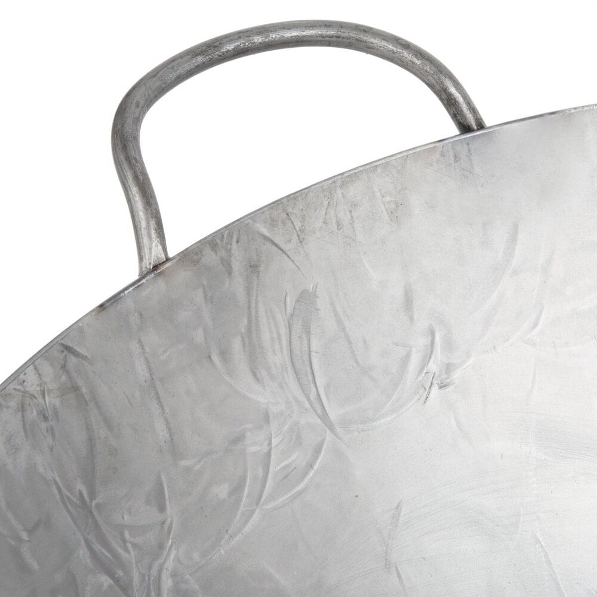 Close-up detail of the welded loop metal handle and hand-hammered carbon steel rim of the Town 34722 wok