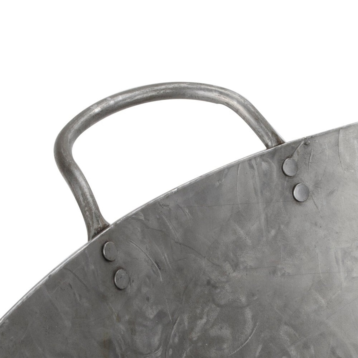 Close-up of the riveted handle attachment on the Town 34728 Cantonese wok showing four rivet points