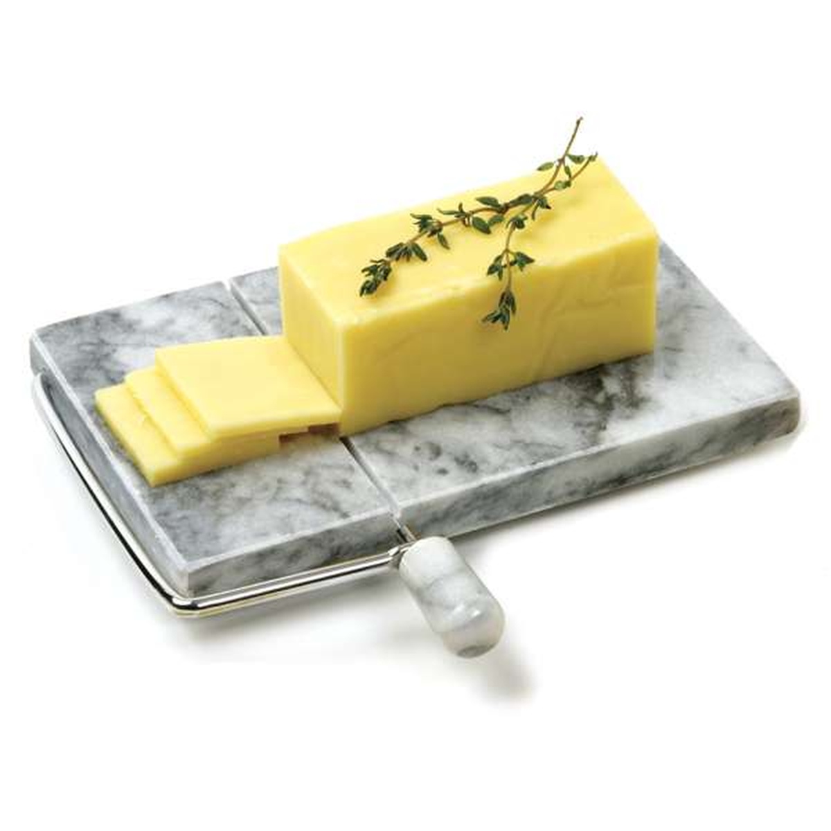 Marble cheese slicer being used to cut a block of butter or soft cheese with a garnish