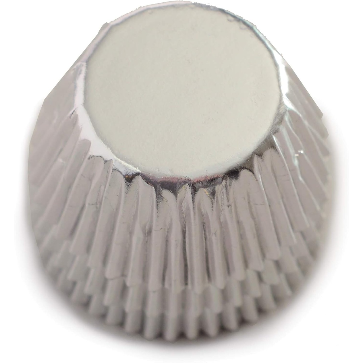Close-up view of a single Norpro mini silver foil baking cup showing its fluted sides and flat base