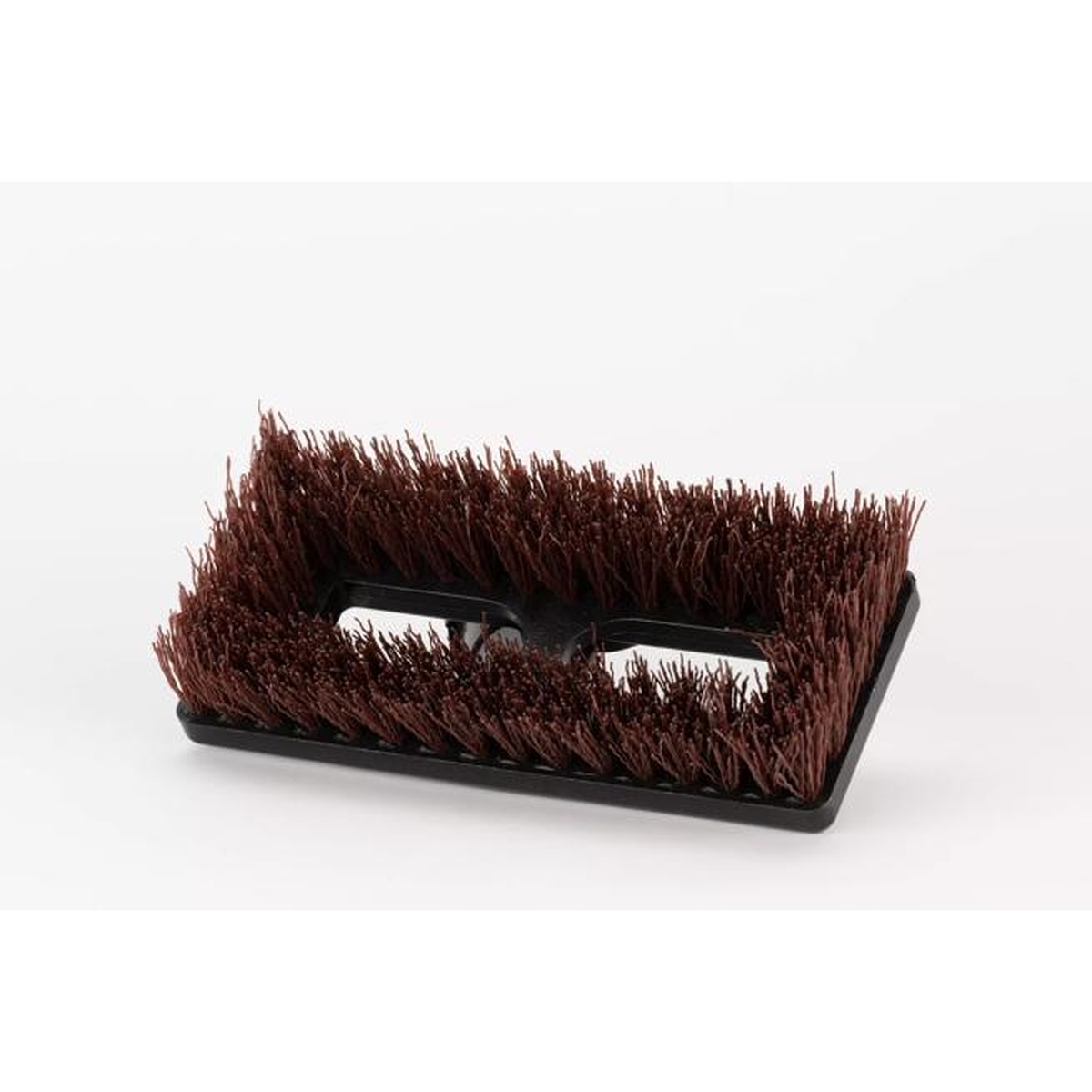 Close-up top view of rust-colored DuPont Tynex A nylon grit bristles on black plastic block